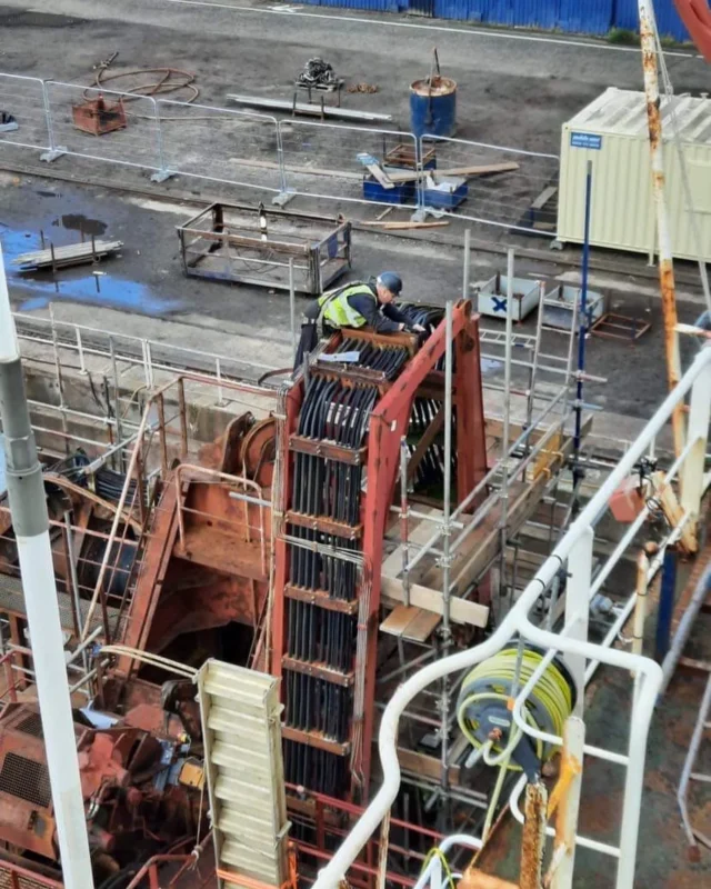 Engineer carrying out marine generator repair work in dry dock