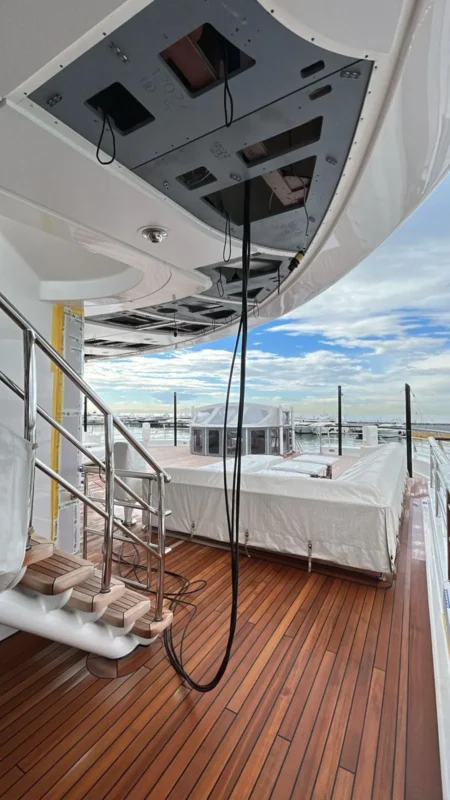 Superyacht aft deck with teak decking and seating