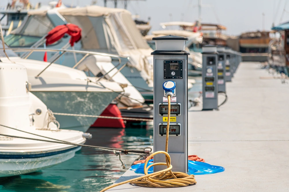 Marina shore-power pedestal supplying electrics to moored yachts
